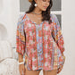 Plus Size Printed Tie Neck Balloon Sleeve Blouse