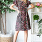 Heimish Full Size Printed Ruffled Short Sleeve Dress with Pockets