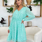 Double Take Full Size Printed Ruched V-Neck Long Sleeve Dress