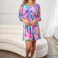 White Birch Full Size Multi Printed V-Neck Tie Back Mini Dress