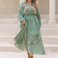 Plus Size Tassel Printed Tie Neck Long Sleeve Midi Dress