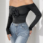 Perfee Ruched Flower Off-Shoulder Long Sleeve Bodysuit
