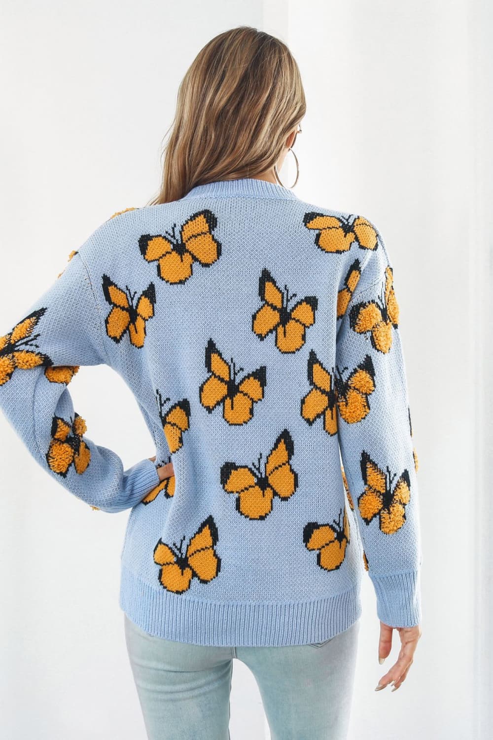 TrendiStyles Butterfly Pattern Round Neck Dropped Shoulder Sweater 🦋