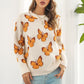 TrendiStyles Butterfly Pattern Round Neck Dropped Shoulder Sweater 🦋