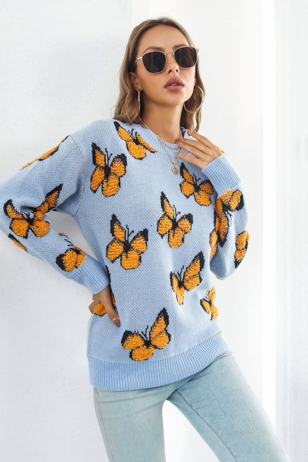 TrendiStyles Butterfly Pattern Round Neck Dropped Shoulder Sweater 🦋