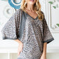 Heimish Full Size Leopard Contrast V-Neck Half Sleeve T-Shirt