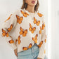 TrendiStyles Butterfly Pattern Round Neck Dropped Shoulder Sweater 🦋
