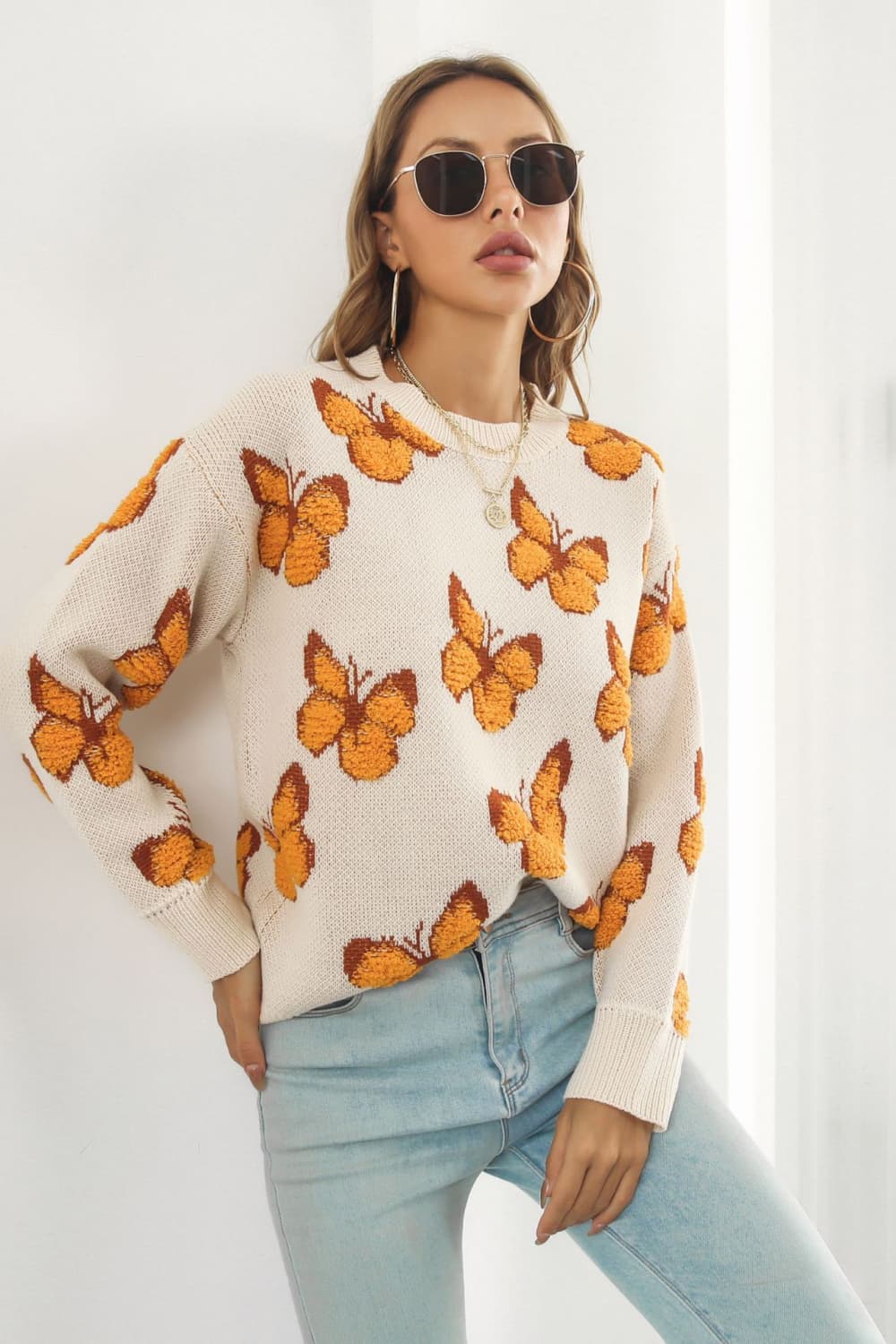 TrendiStyles Butterfly Pattern Round Neck Dropped Shoulder Sweater 🦋