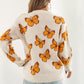 TrendiStyles Butterfly Pattern Round Neck Dropped Shoulder Sweater 🦋